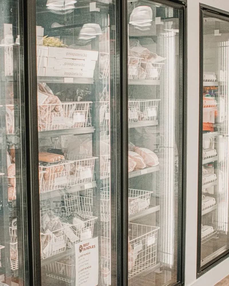 Glass-door commercial freezers stocked with packaged food